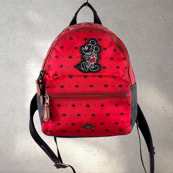 coach disney dalmatian backpack the Pup Camera Bag A molded metal charm of Pongos collar hangs from the bottom These Adorable Coach x Disney